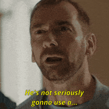 a man with a beard and earrings says he 's not seriously gonna use a