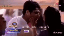 a man and a woman are kissing in front of a sign that says sidd 's princess
