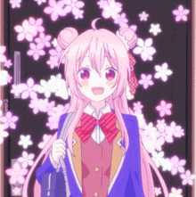 a girl with pink hair is standing in front of a wall with pink flowers