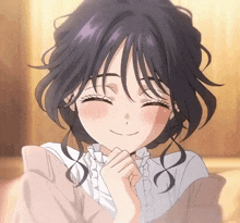a close up of a girl 's face with her eyes closed