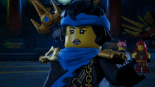 a ninjago character with a blue scarf around her neck