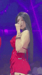 a woman in a red dress with the name mimi on the bottom right
