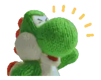 a green and white stuffed animal with a knitted hat