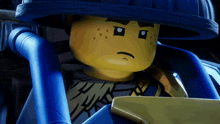 a close up of a lego character with a hat on
