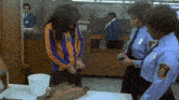 a woman is being searched by a security guard