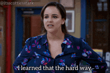 a woman in a floral shirt says i learned that the hard way