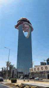 a very tall building with a scarf on top