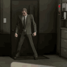 a man in a suit is standing in a doorway with the words welcome to minnmax written on it .