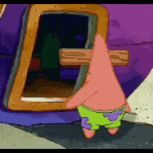patrick star from spongebob squarepants is standing in front of a window