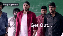 a group of men are standing next to each other in front of a chalkboard .