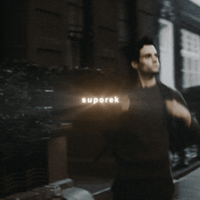 a blurry picture of a man with the word suporek on the bottom right