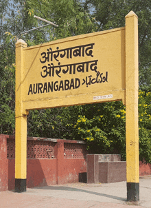 a yellow sign that says ' aurangabad ' in black letters