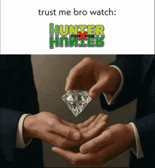 a man in a suit is holding a diamond in his hands with a hunter x hunter logo behind him