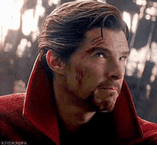a close up of a man 's face with blood on it