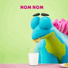 a cartoon dinosaur eating cookies with the words nom nom above him