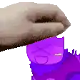 a hand is putting a purple cartoon character on top of a purple cartoon character .