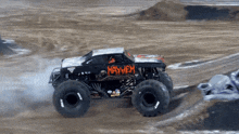 a monster truck with the word mayhem on the side