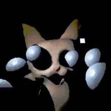 a close up of a cat 's face and paws in a dark room