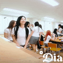 a group of girls in school uniforms are gathered in a room with the word dia on the bottom