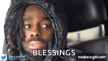a man wearing a hooded jacket says blessings on a gif