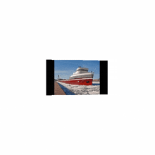 a picture of a red and white ship that says ' icebreaker ' on the side