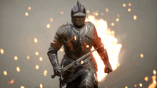a knight in armor is holding a sword in front of a fire explosion