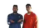 a man wearing an orange adidas jacket stands next to another man wearing a blue jacket