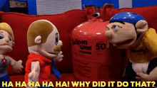 three stuffed animals are standing in front of a balloon container that says 50