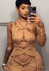 a woman is taking a picture of herself in a mirror with her phone