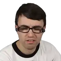 a man wearing glasses and ear buds makes a sad face
