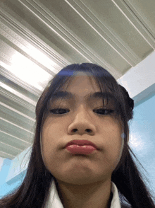 a close up of a girl making a face