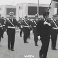 a black and white photo of a military parade