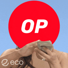 a woman is holding money in front of a red circle with the word op on it