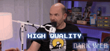 a man sitting in front of a microphone with the words high quality dark web written on the bottom