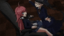 two anime girls are sitting next to each other on a chair .