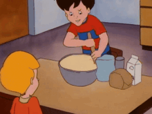 a boy in a red shirt mixing something in a bowl