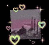 a picture of a hand surrounded by hearts and stars