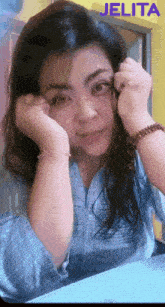 a picture of a woman with the name jelita on the bottom right
