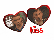 two red heart shaped mirrors with the word kiss on it