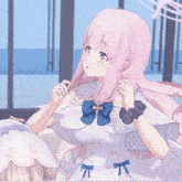 a girl with pink hair and a blue bow on her dress