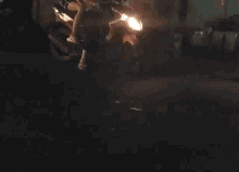 a group of people are riding motorcycles at night