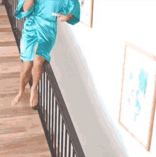 Sliding Down The Bannister GIF - Sliding Down The Bannister Towel On Head GIFs