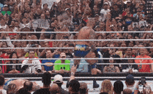 a wrestler in a ring with a sign that says shine