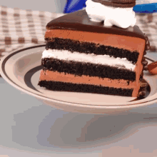 a slice of chocolate cake with whipped cream on top