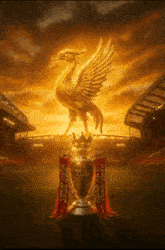 a golden statue of a bird holding a trophy that says premier league on it
