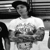 a man wearing a t-shirt that says obey on it