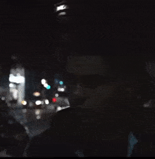 a blurry picture of a man 's face with a street in the background