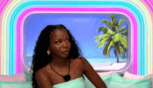 a woman is sitting in front of a window with the name cheley on it