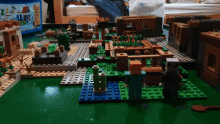 a lego set is sitting on a table with a bag of lego bricks in the background