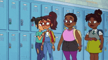 a group of girls are standing in front of a row of lockers